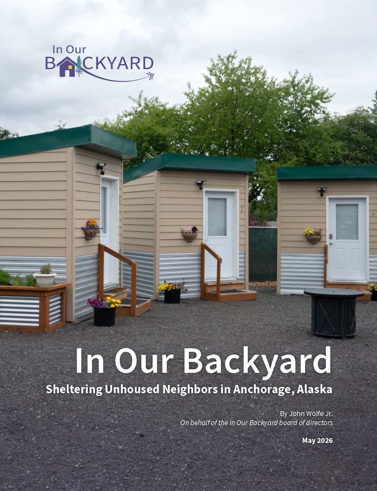 In Our Backyard book cover page with photo of cabins, IOBY logo, and title of book: Sheltering Unhoused Neighbors in Anchorage, Alaska.